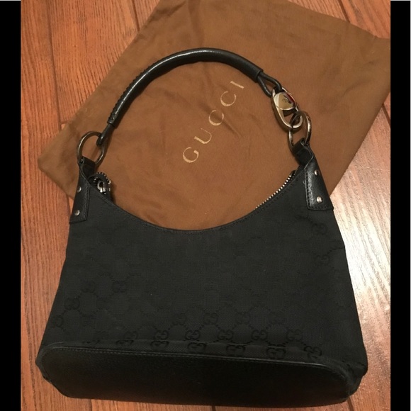 Gucci Handbags - GUCCI black canvas and leather purse.